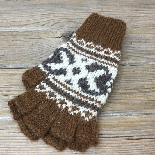 A pair of brown and white alpaca half-finger gloves on a wooden surface.