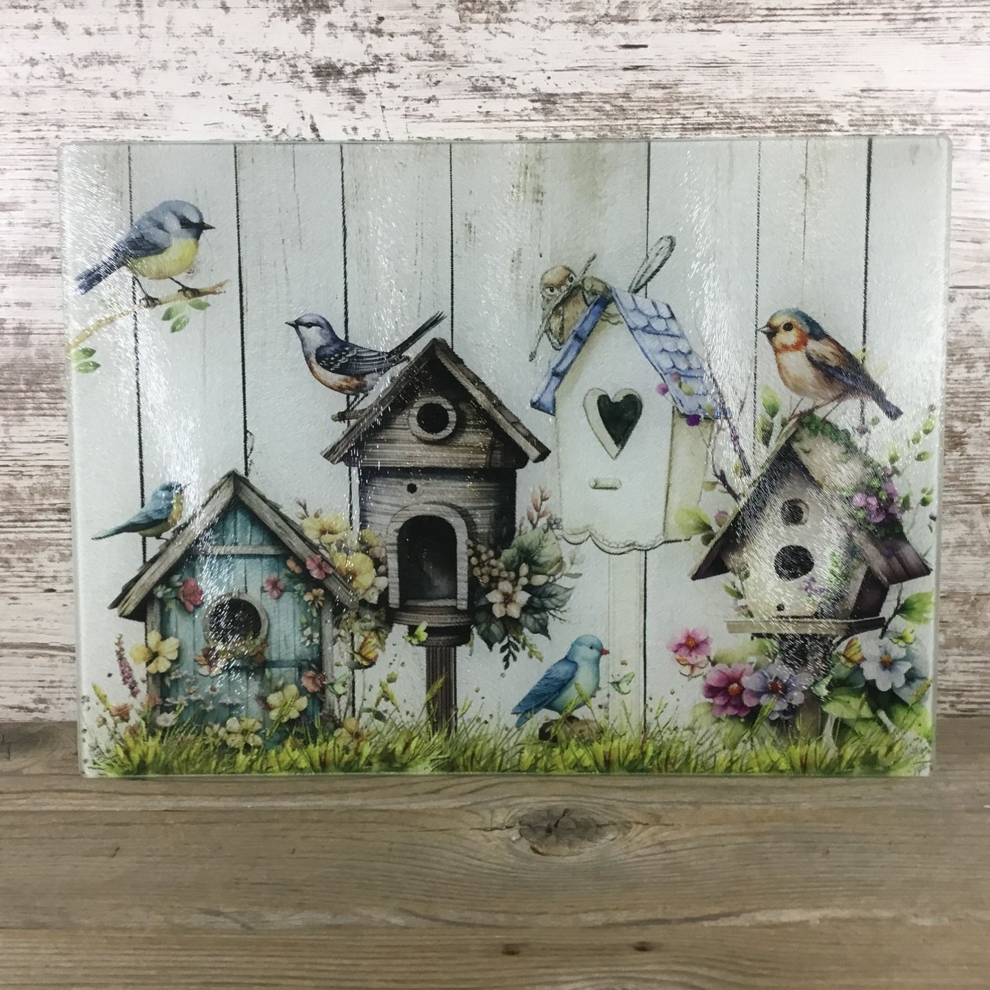 Birds, Flowers & Bird Houses on a glass cutting board