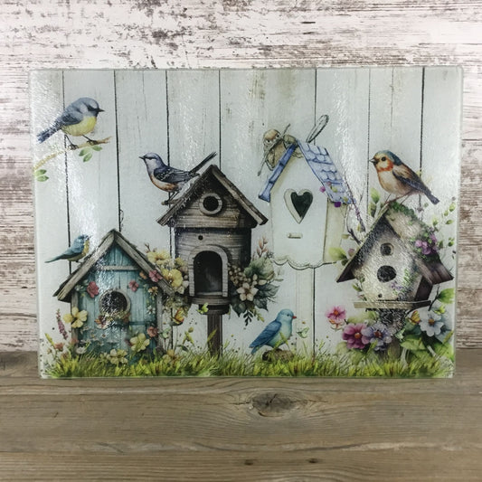 Birds, Flowers & Bird Houses on a glass cutting board