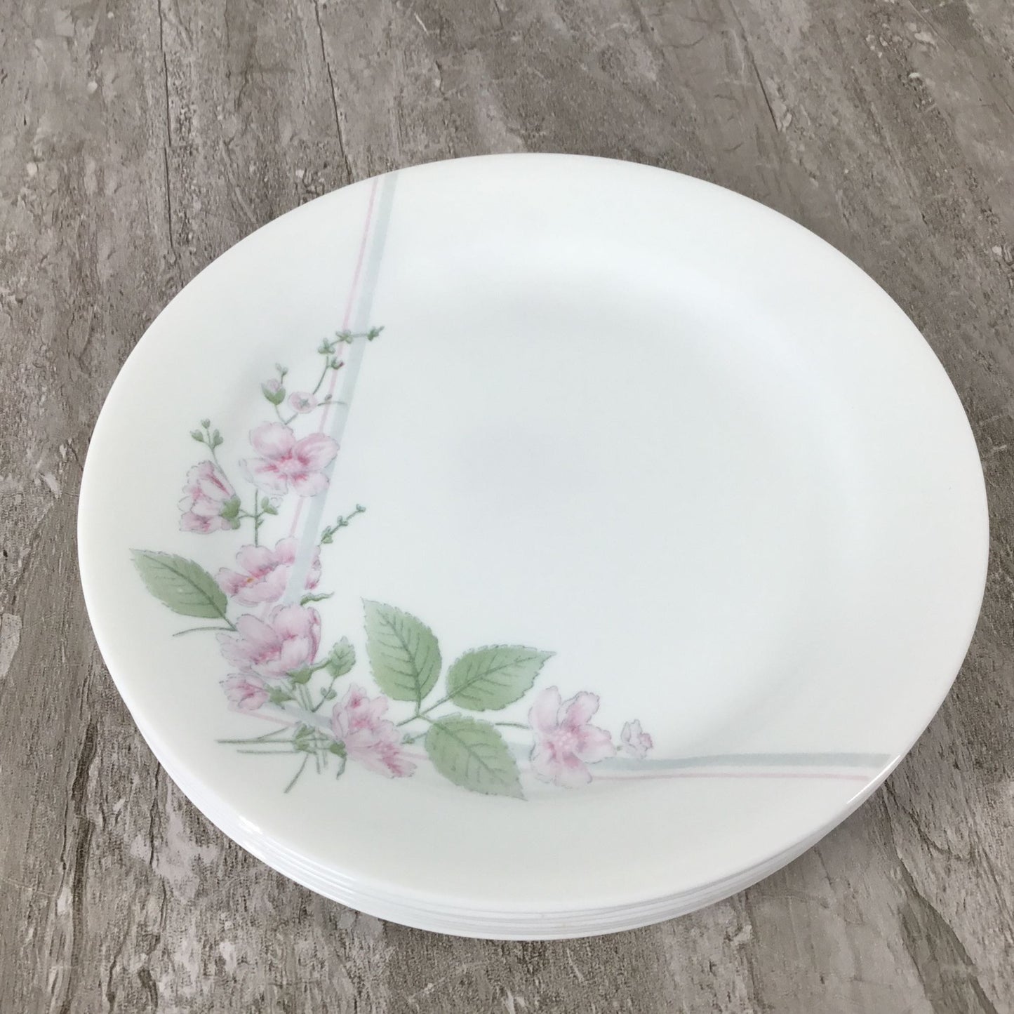 Corelle Veranda White plate with floral design on a wooden surface