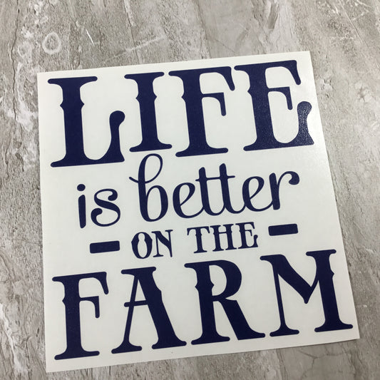 Sticker with 'Life is better on the farm' text on a textured surface