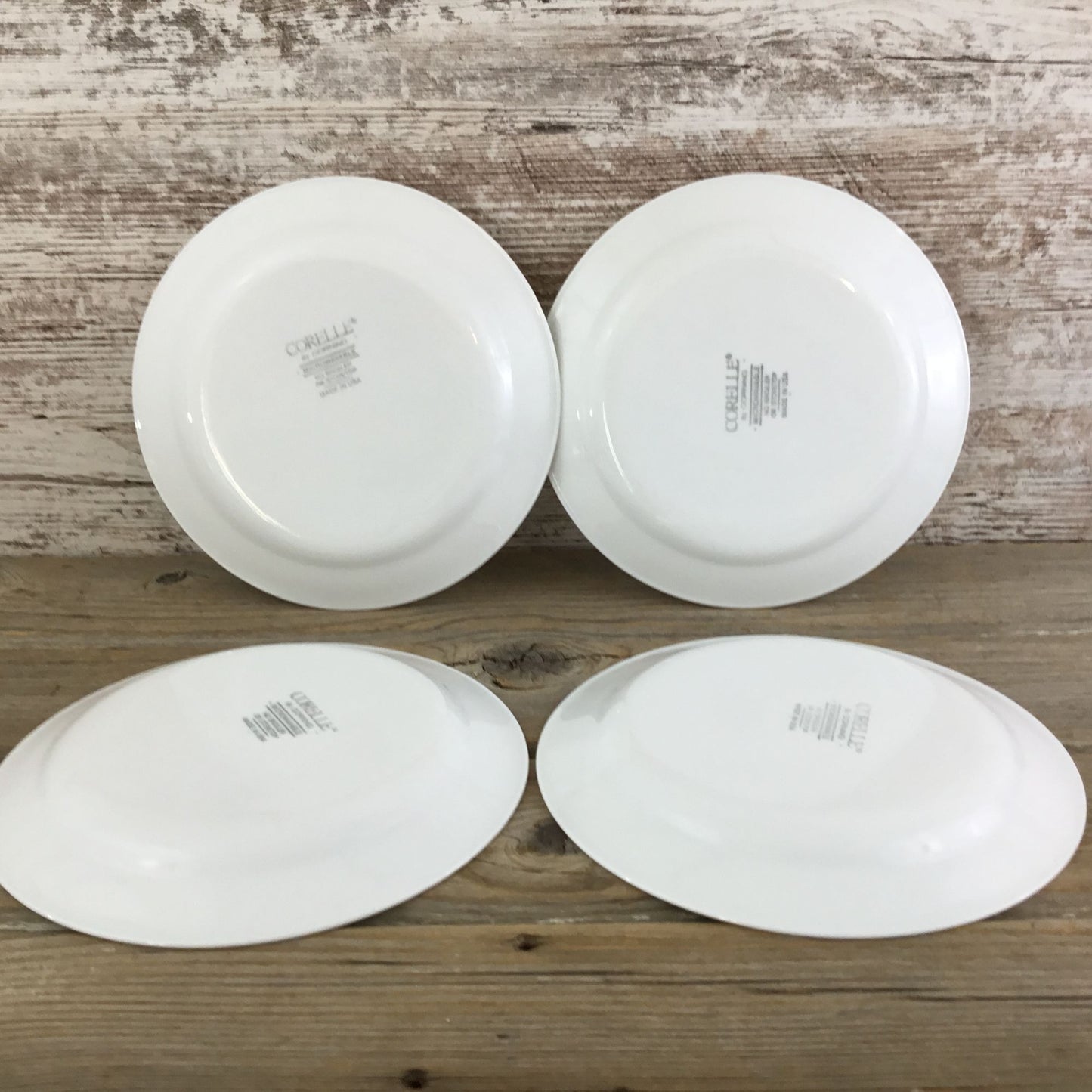 Back of Four Corelle plates 