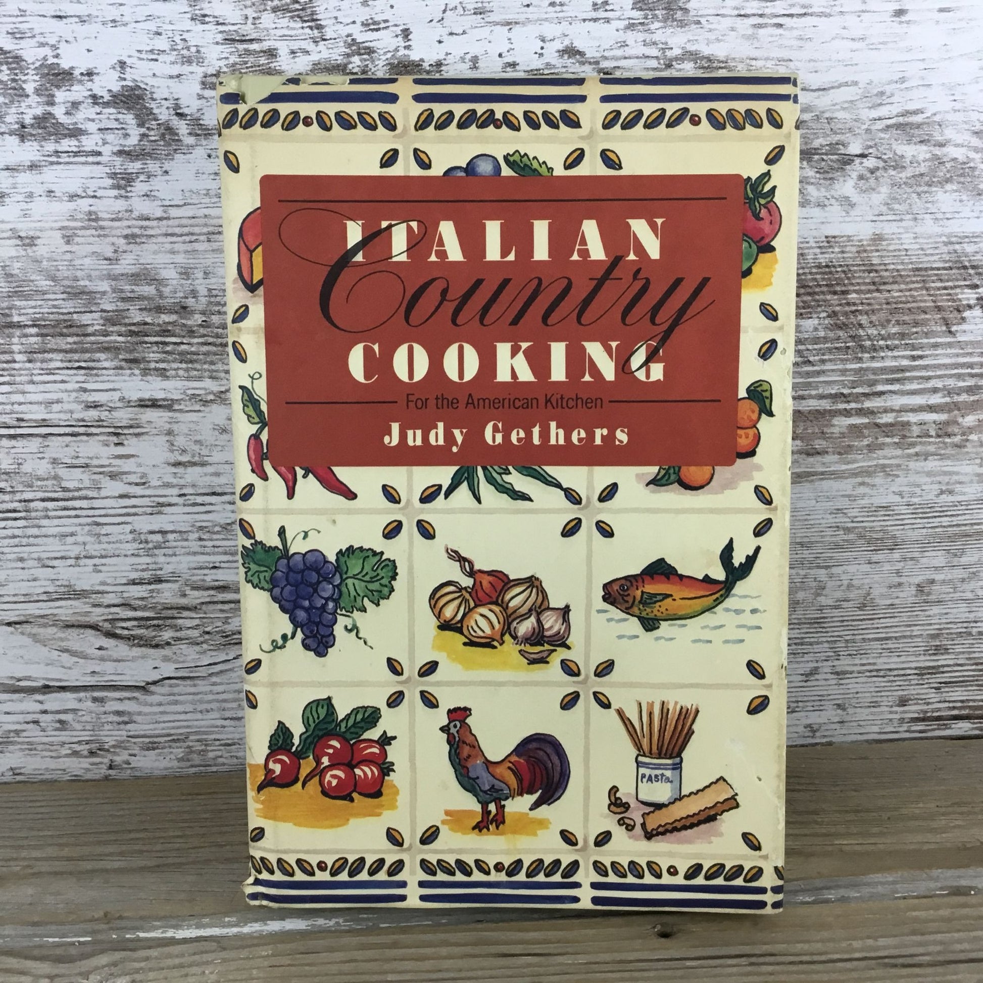 Cookbook titled 'Italian Country Cooking' by Judy Gethers on a wooden surface