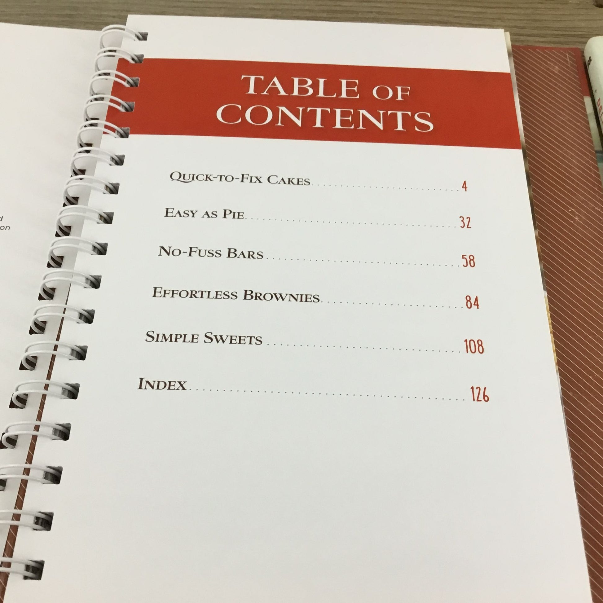 Table of contents from a cookbook on a wooden surface