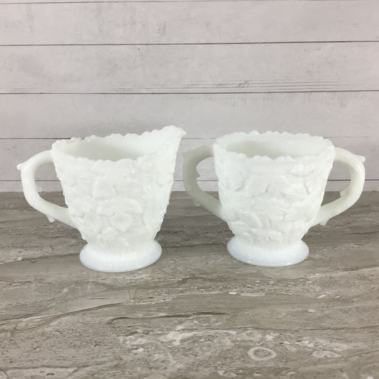 Milk Glass Cream and Sugar with textured surface on a wooden surface.